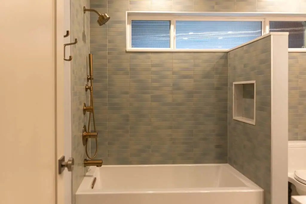 Custom walnut vanity with champagne bronze hardware