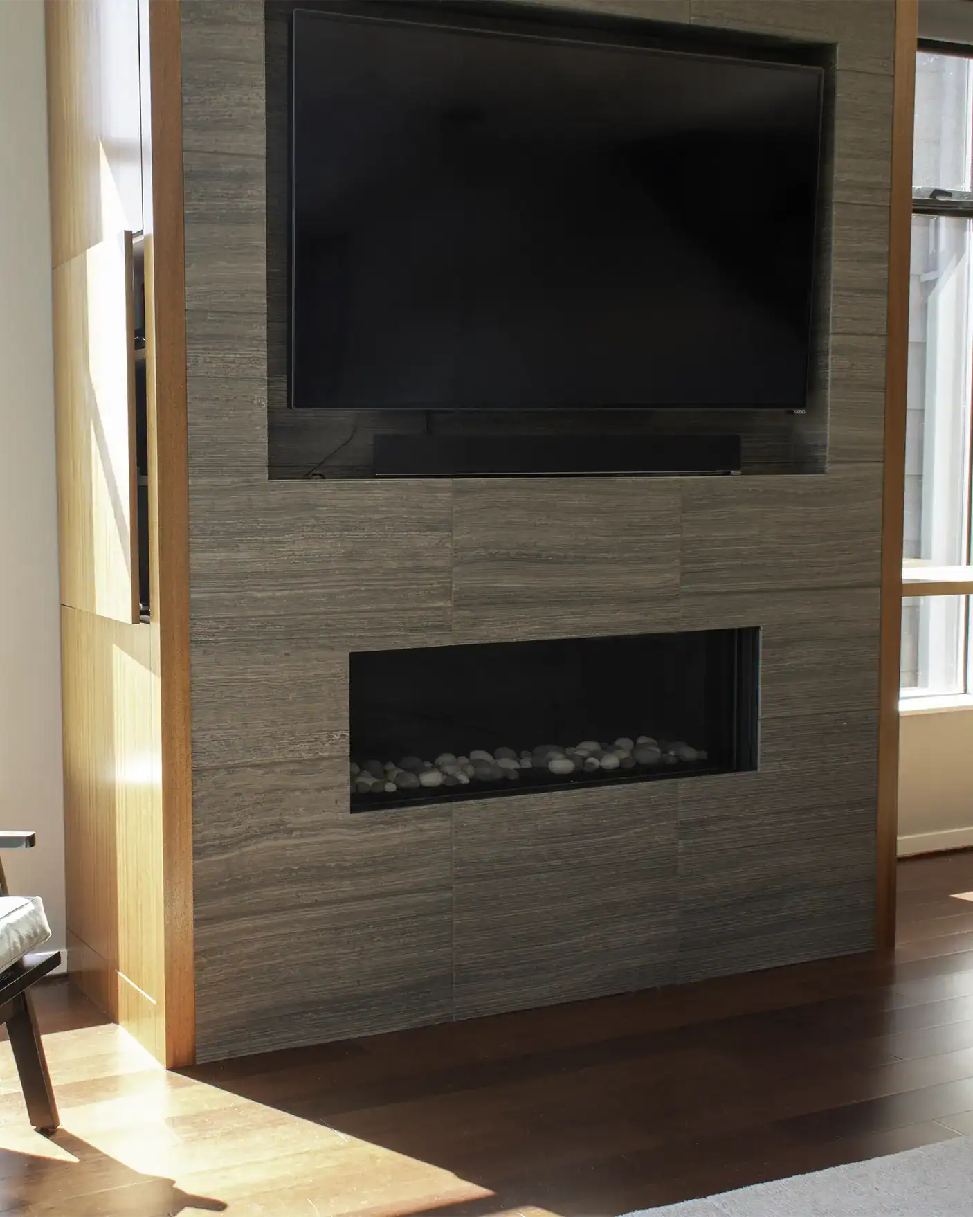 Custom media storage with tile fireplace surround and inset TV