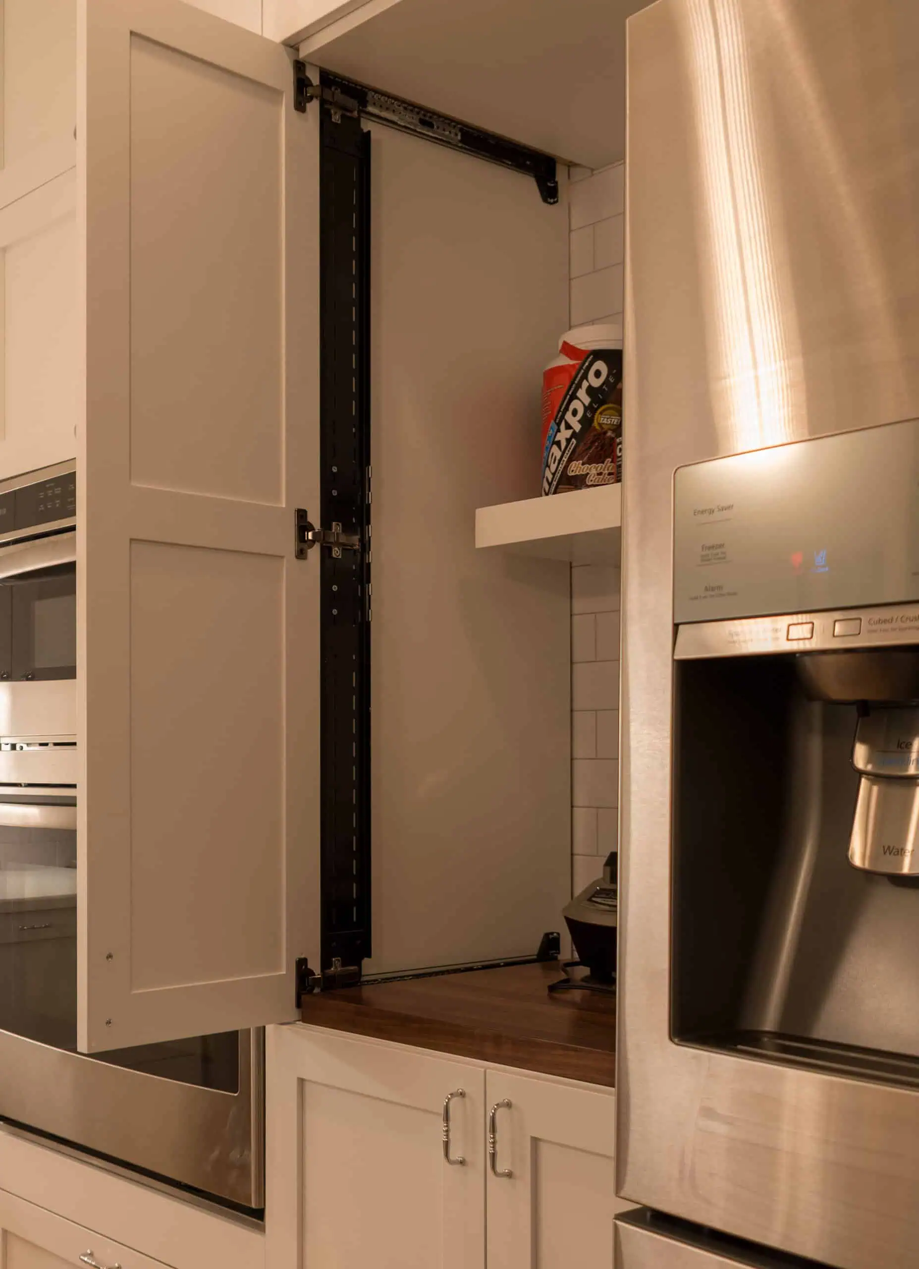 Appliance garage with pocket door and walnut butcher block countertop
