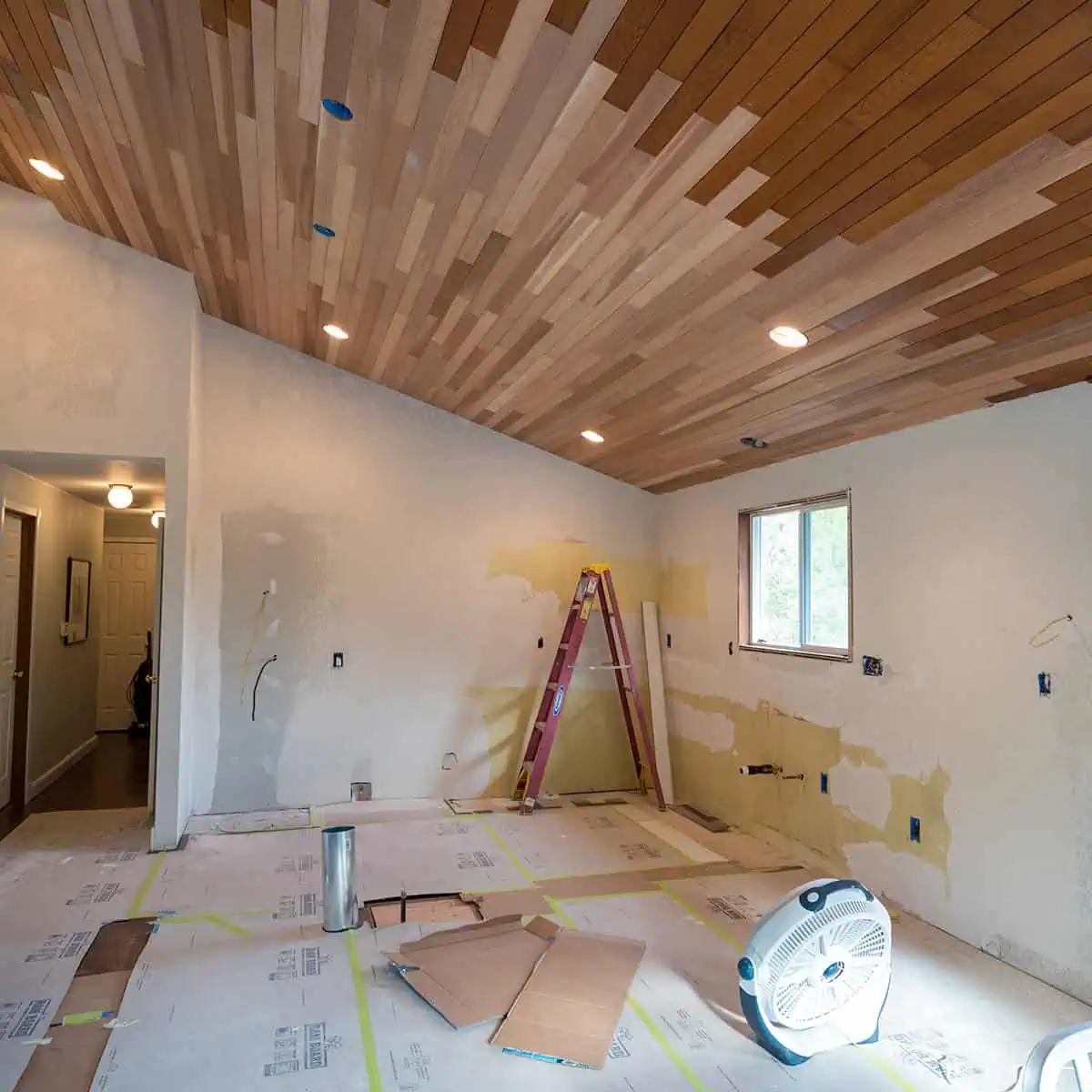 Kitchen remodel in progress with vaulted ceiling