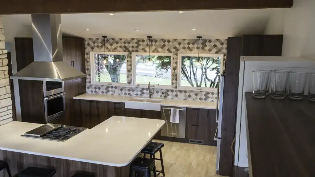 White quartz peninsula with canopy hood and farmhouse sink