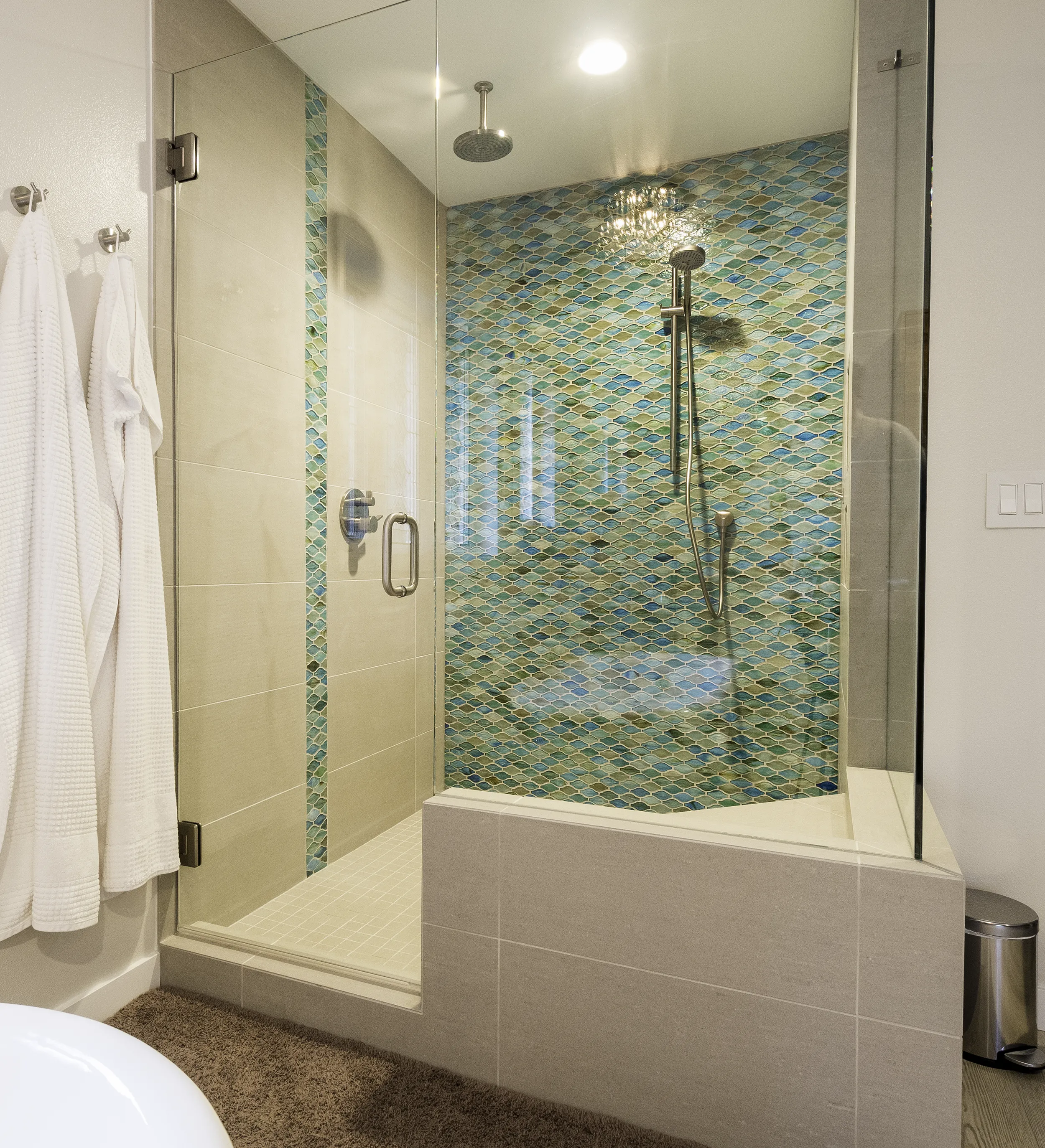 Sammamish primary bathroom walk-in shower with teal fish-scale mosaic tile