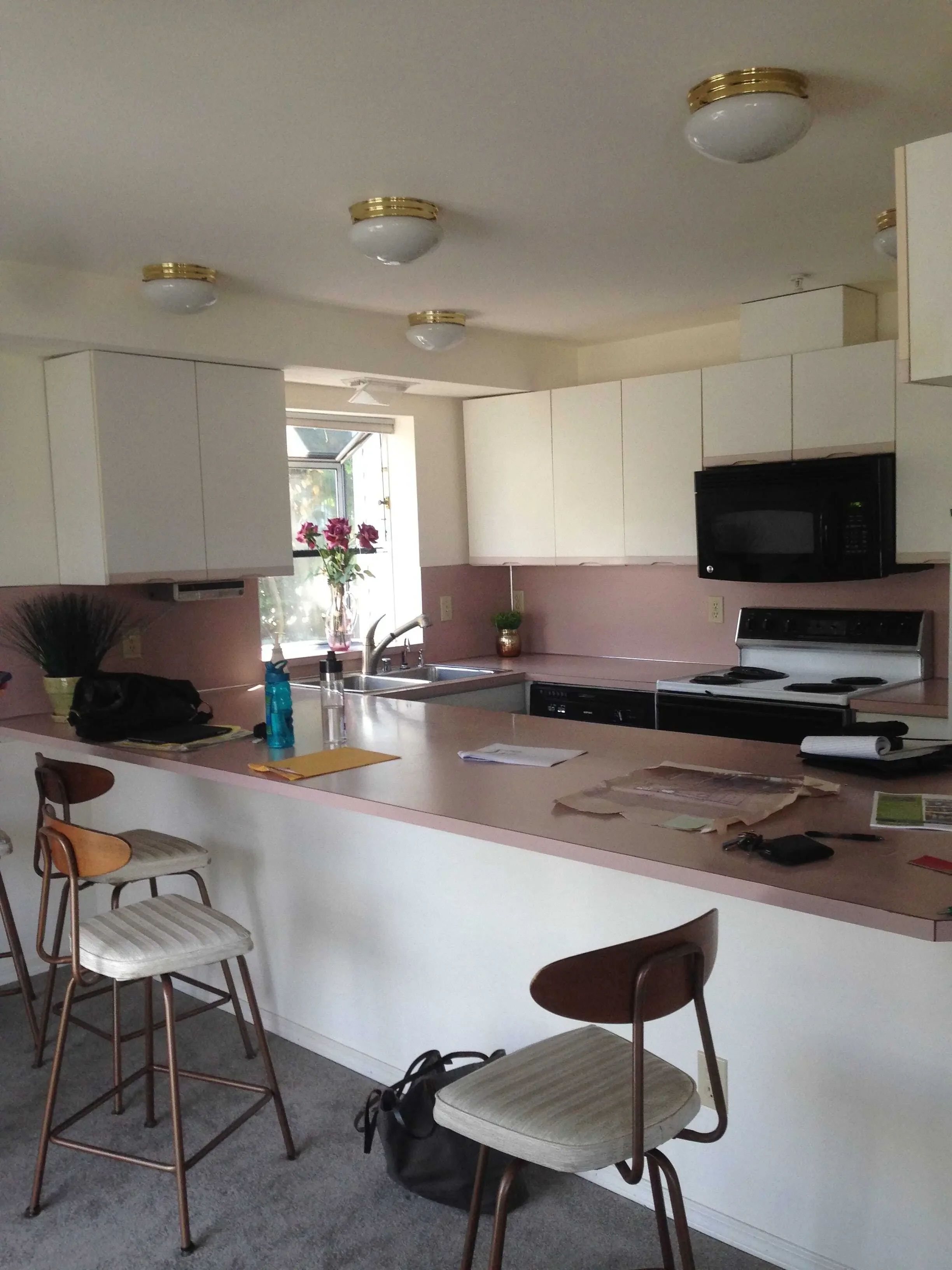 Apartment kitchen before custom IKEA cabinet door remodel
