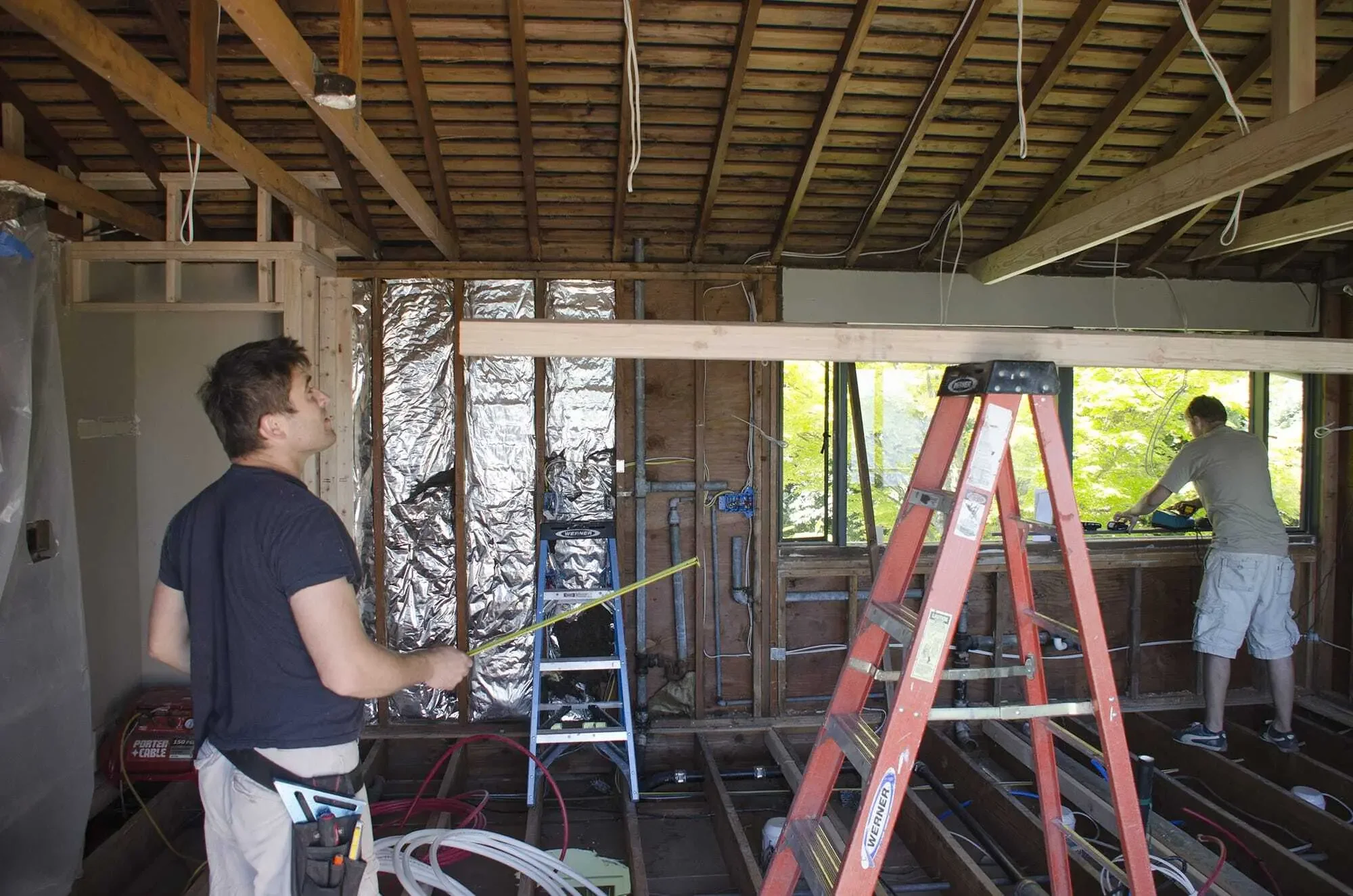 Installation of the exposed posts and beams begins