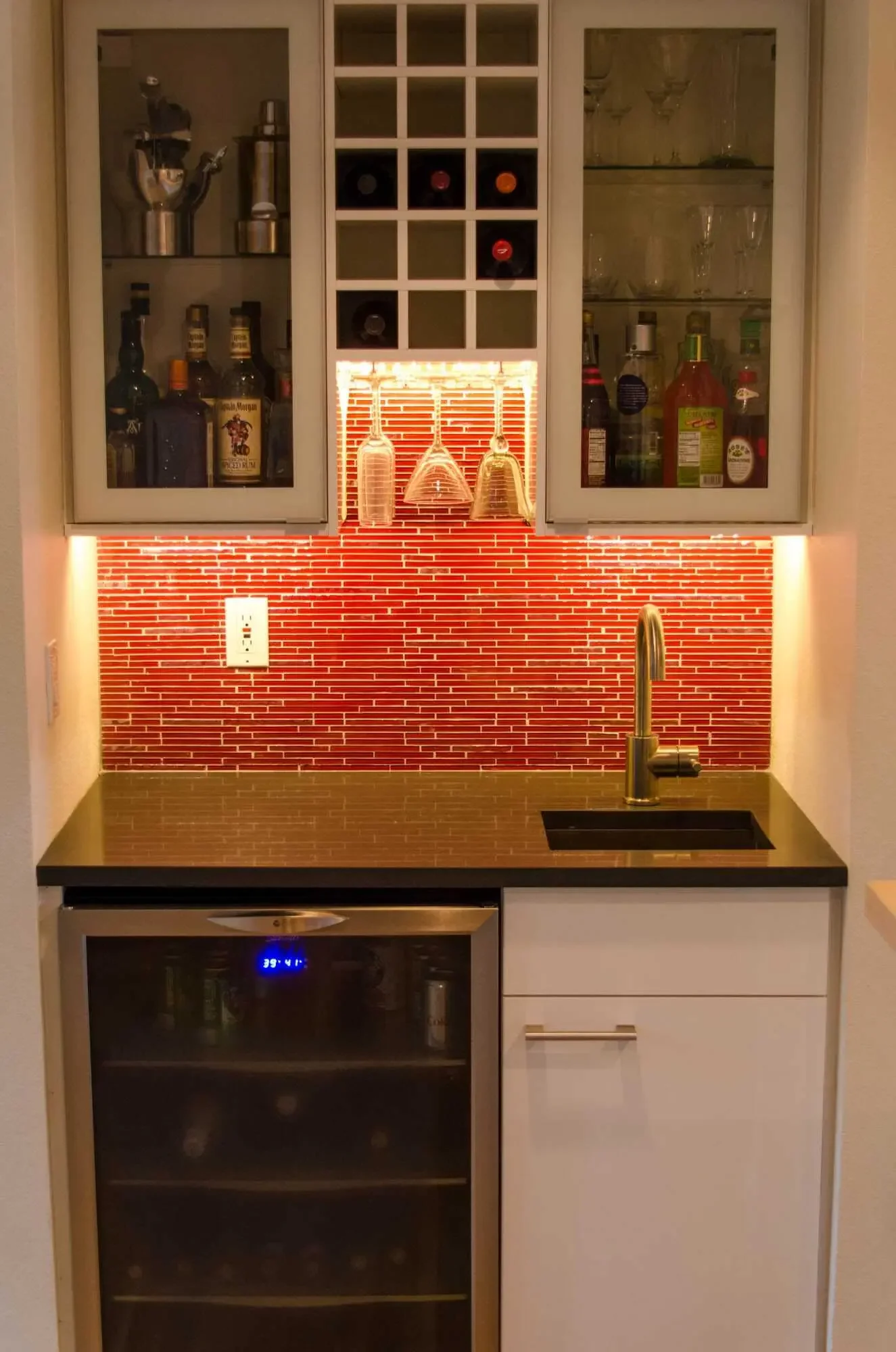 Wet bar/beverage station with site-made wine shelf made with IKEA cover panels
