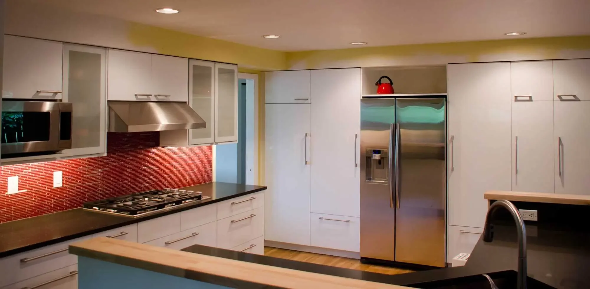 Plenty of storage here, with a whole wall full of full height pantry cabinets!