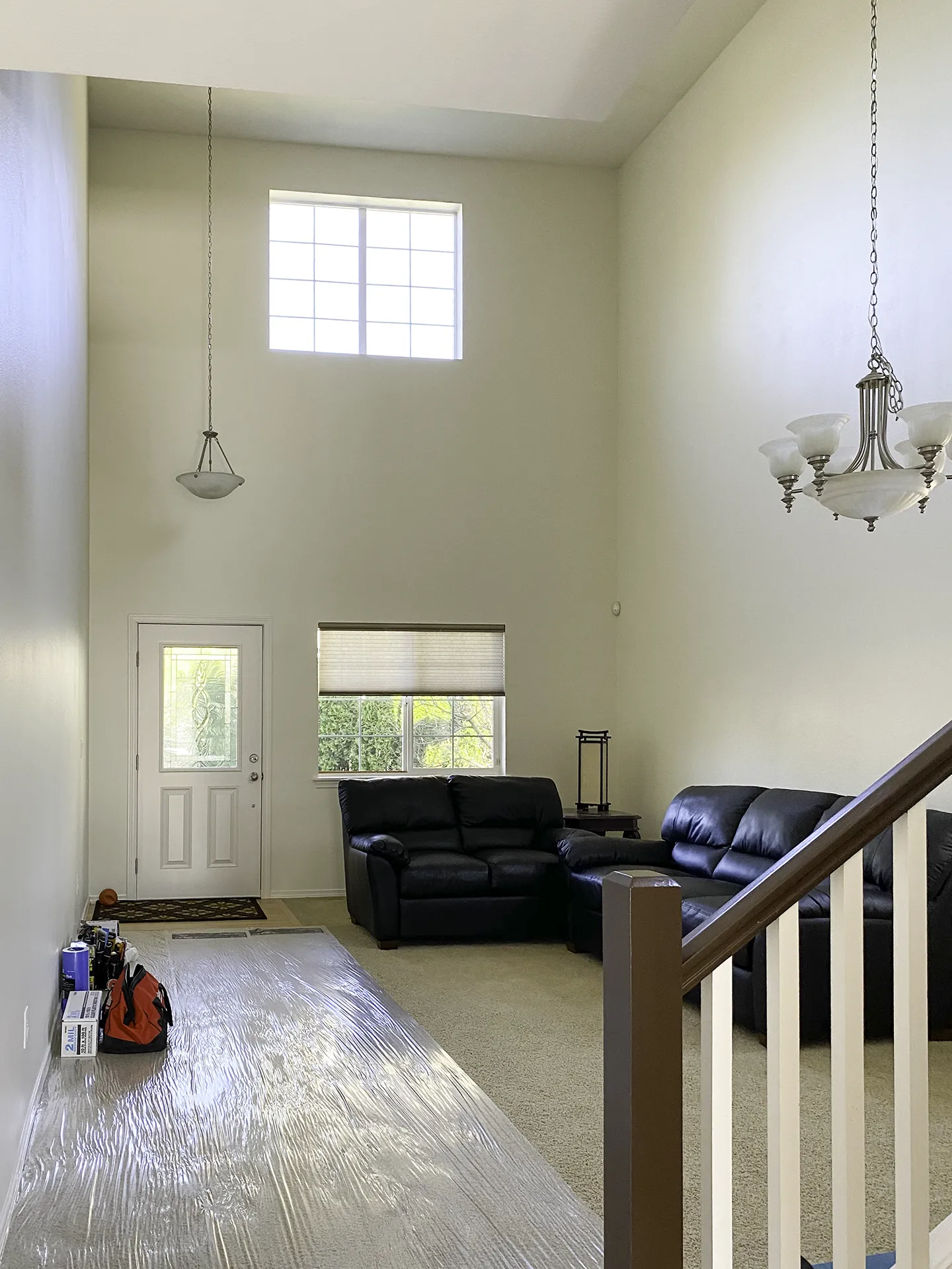 Two-story living room ceiling in Bothell home before bedroom addition