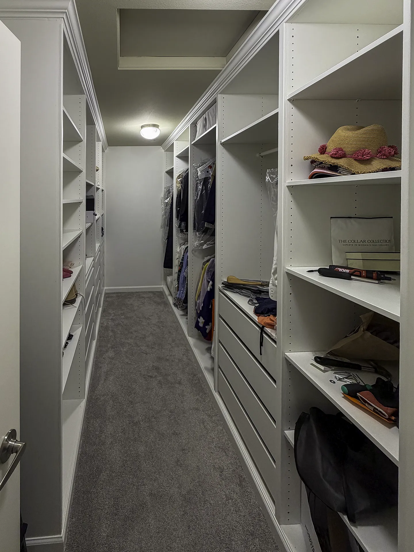 Finished IKEA PAX built-in walk-in closet with crown molding and custom trim